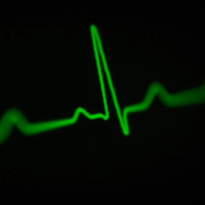 a green heart beat on a black background